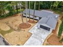 Stunning aerial view of home with large driveway and meticulously maintained landscaping at 1329 Hidden Hills Pkwy, Stone Mountain, GA 30088