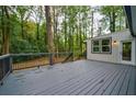Spacious outdoor deck perfect for entertaining and enjoying the wooded surroundings at 1329 Hidden Hills Pkwy, Stone Mountain, GA 30088