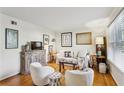 Bright living room showcasing hardwood floors, modern decor, and a large window with natural light at 162 Lablanc Nw Way, Atlanta, GA 30327