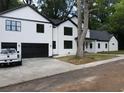 White, two-story home with a black roof, and a freshly laid lawn at 2764 Midway Rd, Decatur, GA 30030