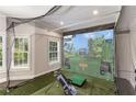 Indoor golf simulator room with screen, projector, hitting mat, and netting for immersive practice and entertainment at 5173 Brendlynn Dr, Suwanee, GA 30024