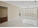 Spacious living room featuring large windows offering lots of natural light and neutral paint at 2499 Peachtree Rd # 506, Atlanta, GA 30305