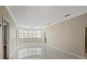 Bright living room featuring large windows offering lots of natural light and neutral paint at 2499 Peachtree Rd # 506, Atlanta, GA 30305