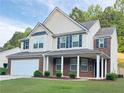 Lovely two-story home boasts well-maintained landscaping, brick accents, and a convenient two-car garage at 5421 Skylar Creek Ln, Buford, GA 30518