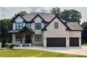 Charming two-story home with brick facade, dark trim, and a well-maintained front lawn at 1952 Azalea Dr, Lawrenceville, GA 30043