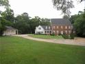 Traditional two-story home with a brick facade and a three-car detached garage at 1811 Murdock Rd, Marietta, GA 30062