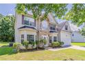 Front exterior of a two-story home with landscaped yard at 4938 Wewatta Sw St, Atlanta, GA 30331