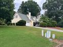 Beautiful single-Gathering home with a lush green lawn and a two-car garage at 750 Providence Dr, Lawrenceville, GA 30044