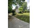 Charming single story home with a covered porch and a spacious front yard at 1095 S Burnt Hickory Rd, Douglasville, GA 30134