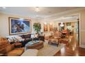 A traditionally decorated living room with an ornate rug, framed art, and hardwood floors at 440 Canton Walk, Roswell, GA 30075