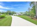 Stunning two-story home with a long driveway and well-manicured lawn at 6301 New Bethany Rd, Buford, GA 30518