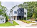 Striking modern home with contrasting black and white exterior, beautiful landscaping, and a welcoming driveway at 178 Wesley Ne Ave # B, Atlanta, GA 30307