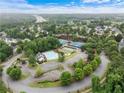 An aerial view showcases the community's amenities, including the pool, tennis courts, and lush landscaping at 412 Mcafee Nw Ct # 14, Kennesaw, GA 30144
