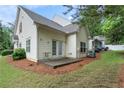 The home features a small backyard area with a concrete patio, ideal for outdoor seating and entertaining at 412 Mcafee Nw Ct # 14, Kennesaw, GA 30144