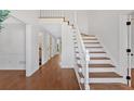 Bright foyer with hardwood floors and staircase at 4990 Sawgrass Nw Pl, Acworth, GA 30102