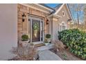Elegant front door with stone accents and welcoming entryway at 4990 Sawgrass Nw Pl, Acworth, GA 30102