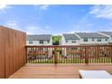 Exterior deck with wooden railing overlooks common green space at 3542 Chattahoochee Summit Se Ln, Atlanta, GA 30339