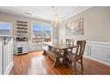 Bright dining area features hardwood floors, chandelier lighting and large window view at 3542 Chattahoochee Summit Se Ln, Atlanta, GA 30339