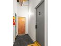 Building hallway featuring a gray entry door numbered 3 and a wooden door numbered 4 at 210 Walker Sw St # 3, Atlanta, GA 30313