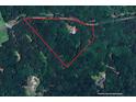 Aerial view showcasing the property's boundaries and heavily wooded lot in a serene, natural setting at 345 Jesse Martin Trl, Canton, GA 30115