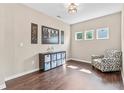 Well-lit living space with hardwood floors, stylish decor, and ample space for relaxation at 6065 Crescent Landing Dr, Cumming, GA 30028