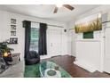 Cozy living room with hardwood floors, white walls, and natural light from the window at 1192 Arlington Sw Ave, Atlanta, GA 30310