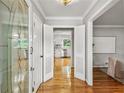 Bright foyer featuring hardwood floors and decorative glass front door leads to the open kitchen at 2516 Cherry Hill Ln, Atlanta, GA 30360
