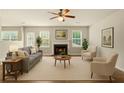 Bright living room featuring a fireplace, large windows, and comfortable seating at 3731 Laramie Rd, Ellenwood, GA 30294