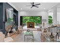 Elegant living room featuring a fireplace and doors leading to an outdoor patio at 5705 Registry Oaks Se Ln, Mableton, GA 30126