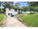 Quaint home with an appealing exterior, showcasing its well-kept lawn and curb appeal at 569 Oakside Sw Dr, Atlanta, GA 30331