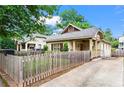 Charming single-story home with a manicured lawn, picket fence, and small front porch at 176 Ormond Se St, Atlanta, GA 30315