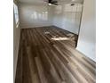 Living room featuring wood-look floors, lots of light, and ceiling fan at 4701 Flat Shoals Rd # 48B, Union City, GA 30291