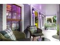 Cozy front porch with comfortable seating, bright yellow door, and stylish decor enhancing the home's appeal at 611 Pickett Se St, Atlanta, GA 30316