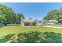 Inviting single-story house featuring a green lawn, blue siding, and a driveway leading to the garage at 647 New England Way, Lawrenceville, GA 30046