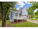 Charming two-story home with light blue siding and a white deck, perfect for enjoying the outdoors at 1139 Mainstreet Valley Dr, Stone Mountain, GA 30088