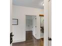 Bright hallway featuring hardwood floors and modern doors that lead to bedrooms and bathrooms at 1300 Dekalb Ne Ave # 221, Atlanta, GA 30307