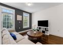 Cozy living room with a comfortable sofa, bright windows, and stylish decor at 1300 Dekalb Ne Ave # 221, Atlanta, GA 30307