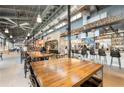 Well-lit restaurant interior with an open bar and a modern industrial design at 6370 Cortland Walk, Alpharetta, GA 30005