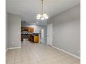 Open floor plan combining the dining area with a glimpse of the kitchen and its appliances at 7712 Autry Cir # 701, Douglasville, GA 30134