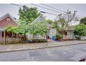 Cozy home on tree-lined street featuring a welcoming front porch and well-maintained yard at 151 Savannah Se St, Atlanta, GA 30316