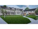 Townhomes with a large communal lawn, fire pit, tables, and playground for residents' enjoyment at 3108 Marbella Cir # 4, Kennesaw, GA 30152