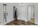 Inviting entryway features wood-look floors, a coat rack, and neutral paint at 3430 Grand Manor Trl, Snellville, GA 30039