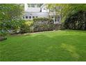 Spacious, well-manicured backyard with lush green lawn, great for outdoor activities at 350 Westchester Way, Canton, GA 30115