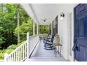 Inviting front porch with rocking chairs and classic design details at 350 Westchester Way, Canton, GA 30115