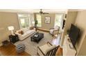 Bright living room features neutral decor, ceiling fan, and lots of natural light at 3641 Ridge Towne Dr, Duluth, GA 30096