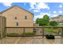 View from back deck showing wooded scenery, creating a serene outdoor space at 4358 Grove Field Ct, Suwanee, GA 30024