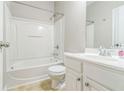 Clean, well-lit bathroom with a shower-tub combo and white vanity at 4358 Grove Field Ct, Suwanee, GA 30024