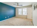 Bright bedroom with neutral carpet, ceiling fan, and light-filled windows at 4358 Grove Field Ct, Suwanee, GA 30024