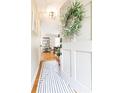 Inviting foyer featuring hardwood floors and a decorative wreath hung on the front door for a warm welcome at 1295 Lindenwood Ne Ln, Brookhaven, GA 30319