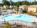 Enjoy the community pool with ample seating for residents to relax and soak up the sun at 1838 Lakeview Bend Way, Buford, GA 30519
